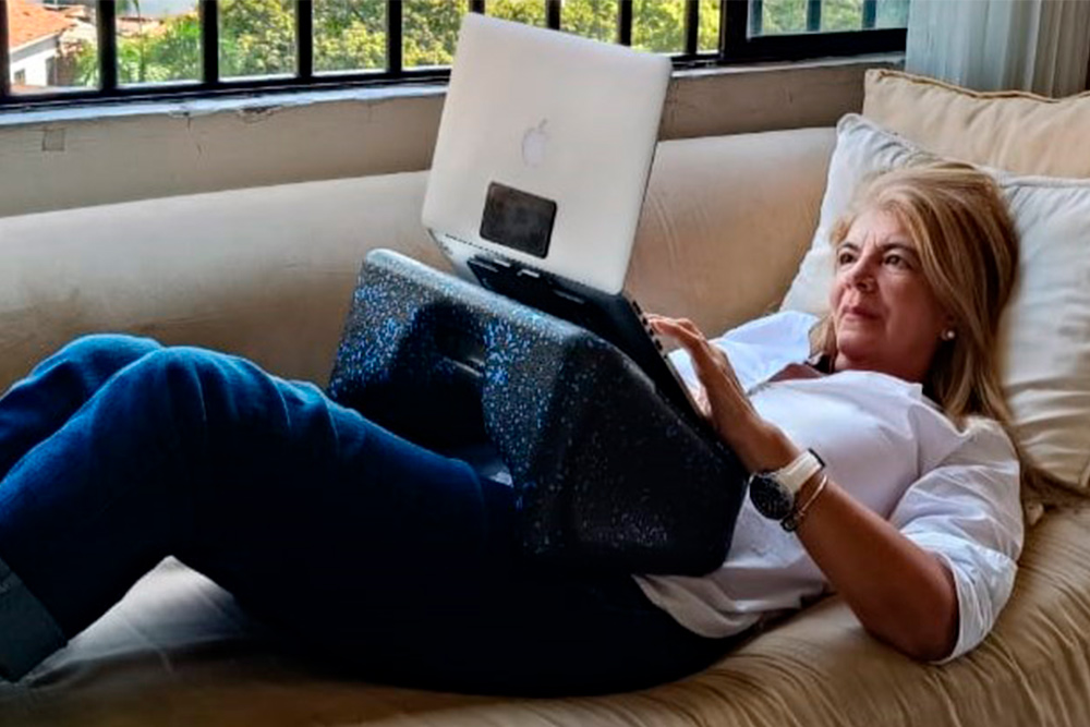 Woman working from her sofa 2