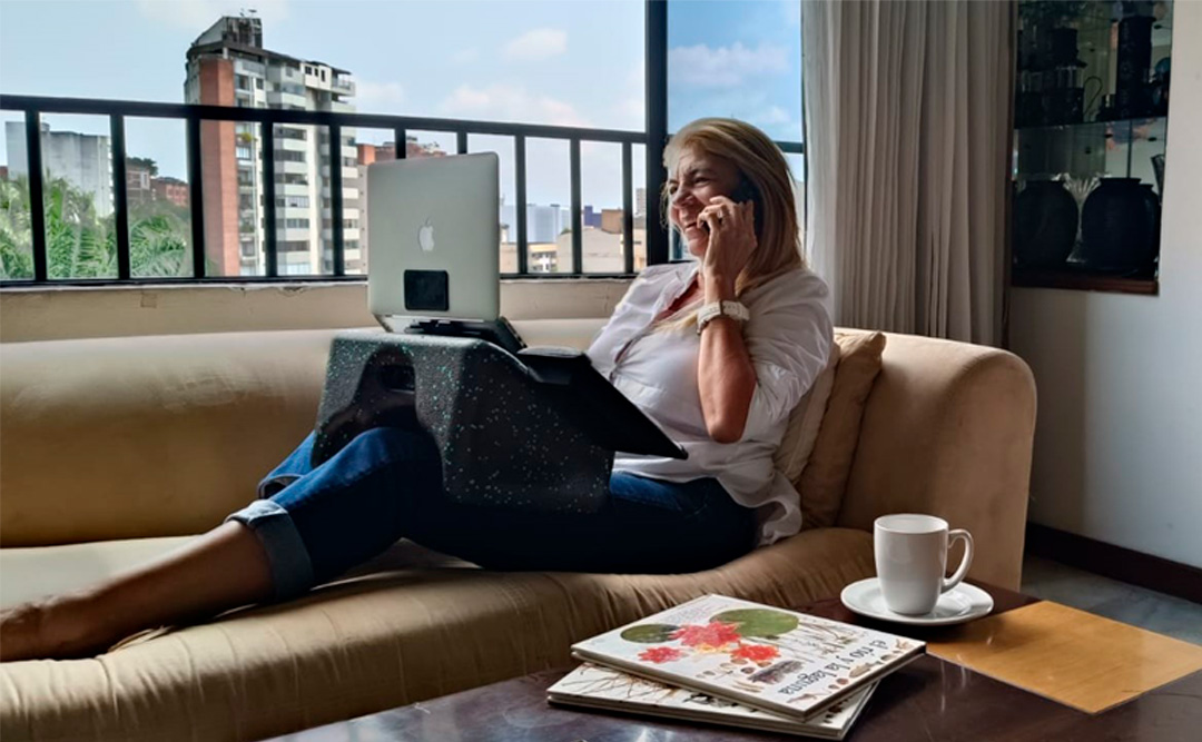 Woman working from her sofa